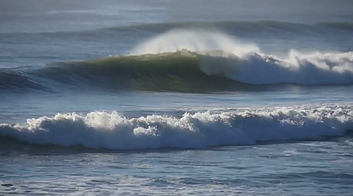 A clean peak stands up over the bank, the shape the Grey River bar throws on its day, Blaketown - Cobden surf spot, West Coas