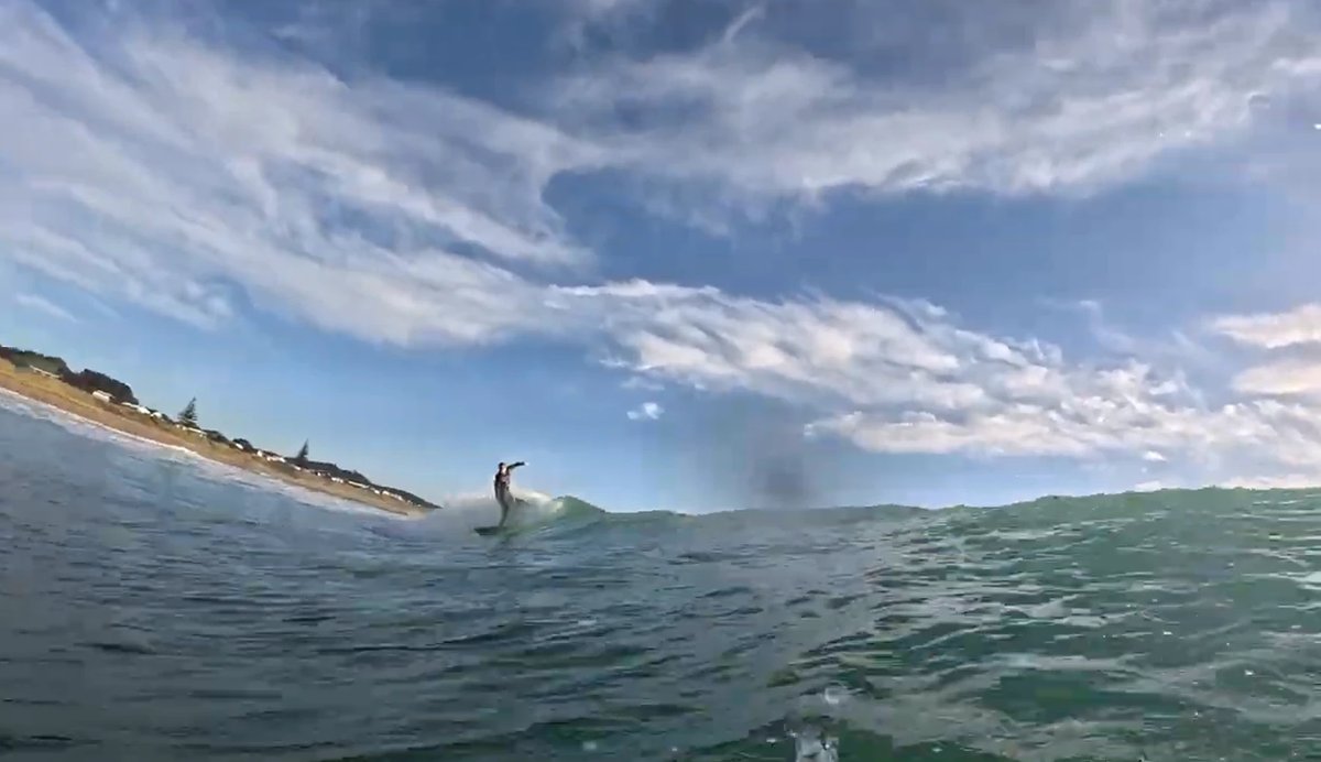 Riding clean on a lay day, Henderson Bay surf spot, Northland East, New Zealand.