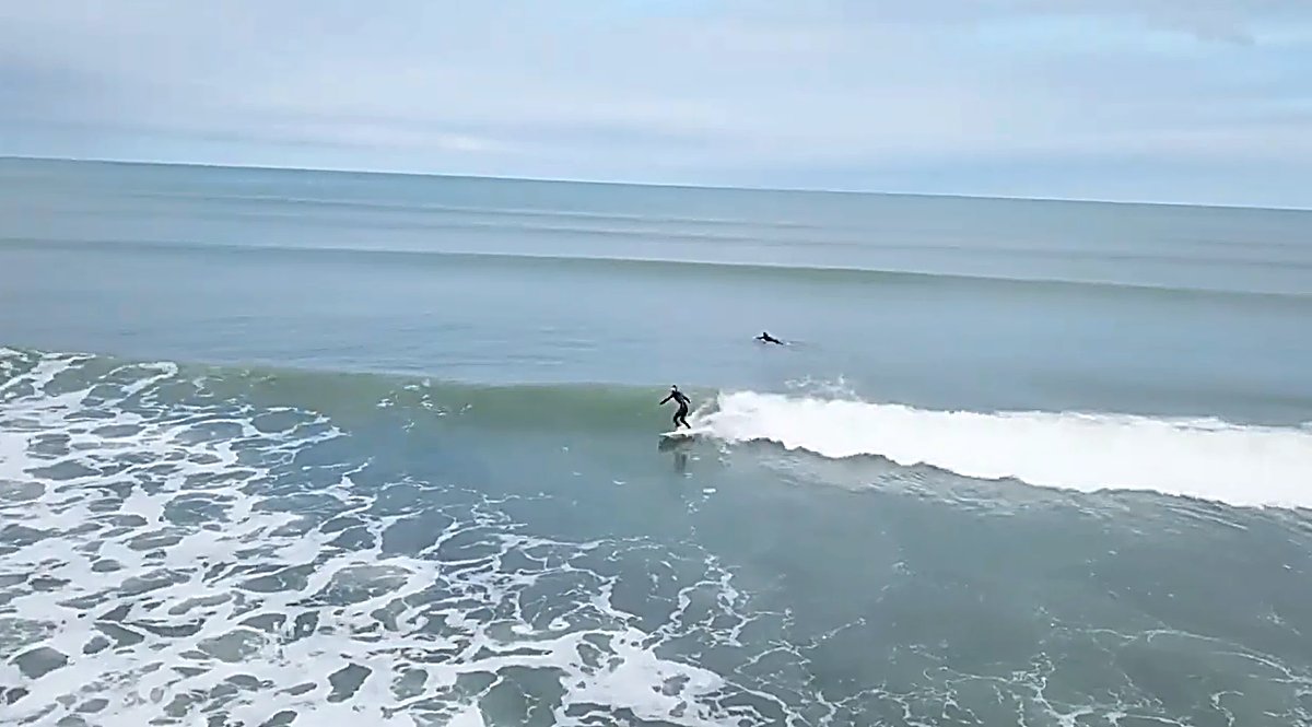 Sharing clean walls on the bar, with plenty of room to go around, Karitane Beach surf spot, Dunedin / Otago, New Zealand.