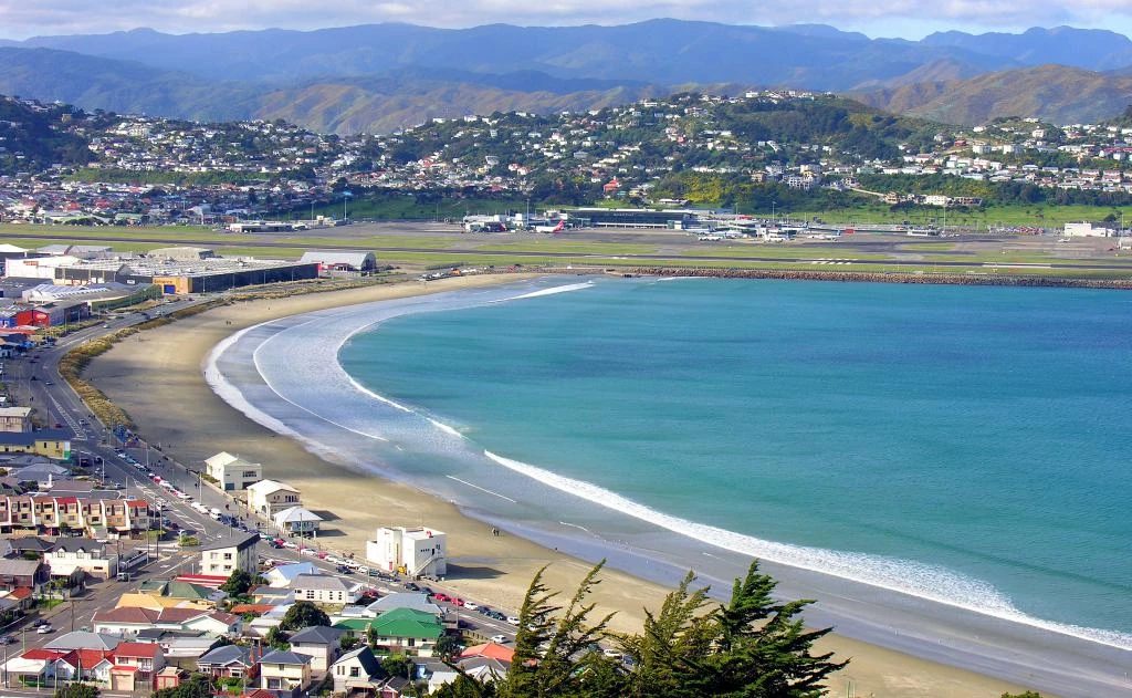 The full sweep of Lyall Bay from the hills, Wellington's home beach with the airport runway along its eastern edge, Lyall Bay