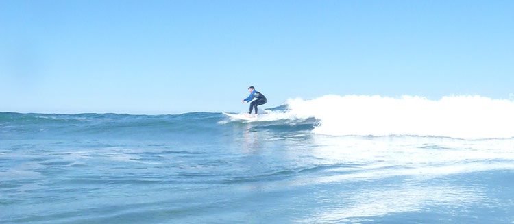 Mellow day for a longboard, Ocean Beach surf spot, Northland East, New Zealand.
