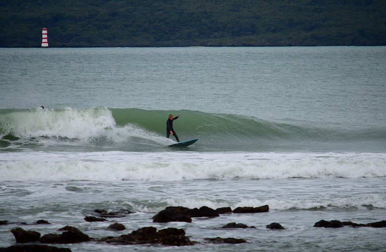 Riding on a small day with Rangitoto behind, Takapuna surf spot, Auckland / Rodney, New Zealand.