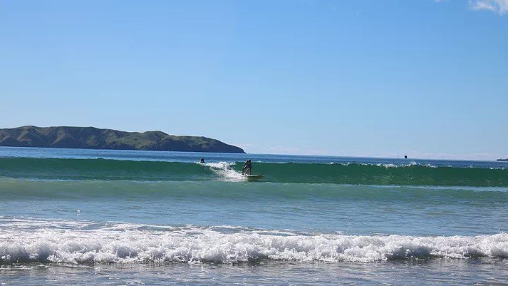 A quiet day on the river bar, the Tākou River meeting the bay, Tākou Bay surf spot, Northland East, New Zealand.