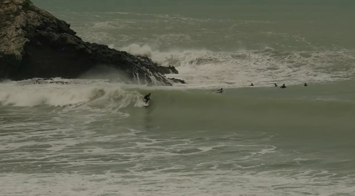 Threading a wave in beside the rocks on a moody, powerful day when the reef corner shows its teeth, Taylors Mistake surf spot